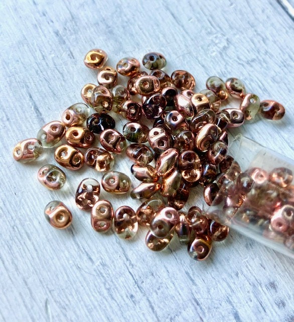 10g two hole tube beads two tone blue and copper.