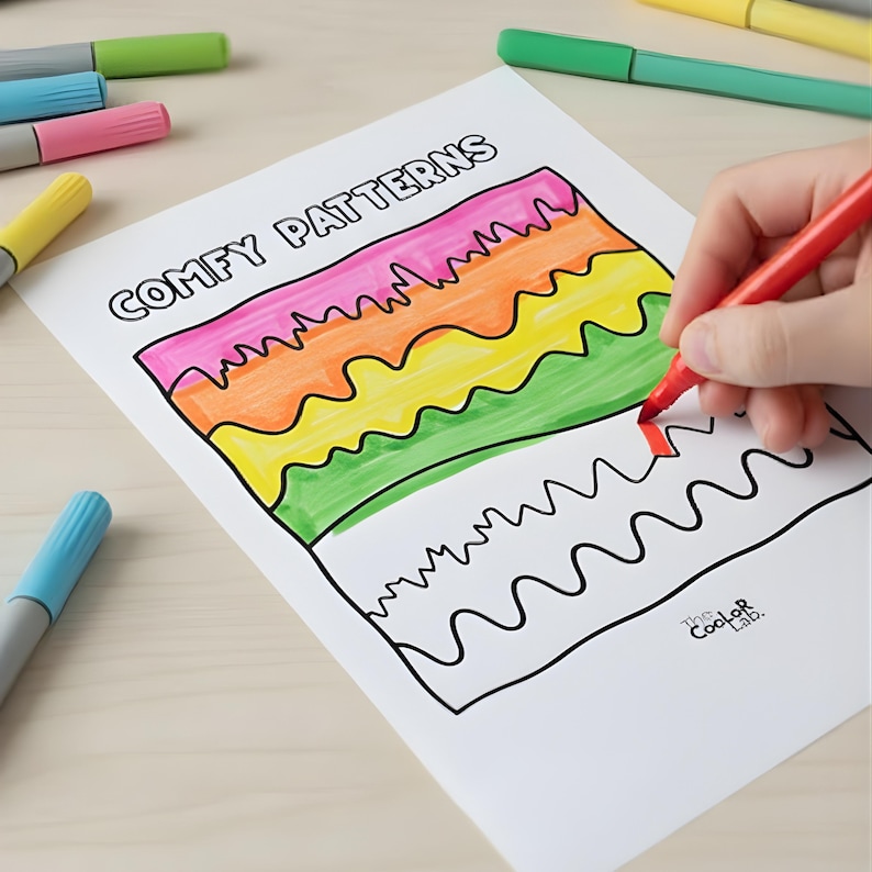 May include: A white sheet of paper with the words "COMFY PATTERNS" printed at the top. The sheet features a colorful, wavy design being colored with a red marker. Several colored markers are scattered around the paper.