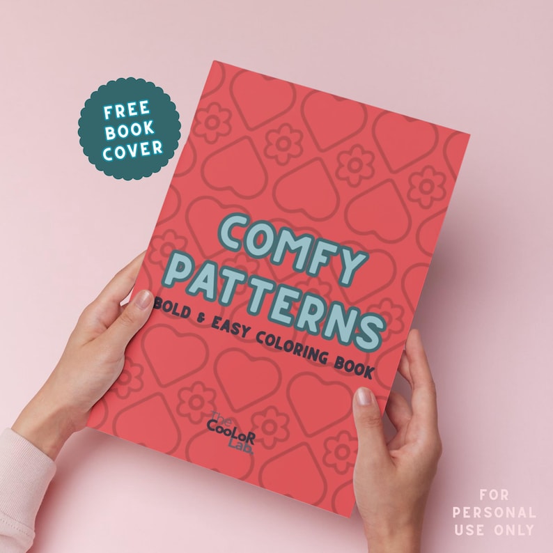 May include: A red coloring book titled "Comfy Patterns" with a pattern of hearts and flowers. The book is held by hands and has the text "Bold & Easy Coloring Book". A teal sticker says "Free Book Cover".