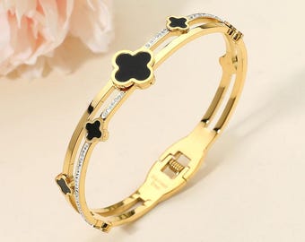Pulsera rígida articulada de acero inoxidable con nácar y circonitas cúbicas en forma de trébol / Elegante pulsera con diseño de trébol