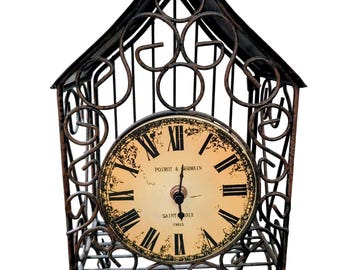 Reloj de repisa de cuarzo Peirat Garmein vintage con marco de jaula de metal y esfera de porcelana.
