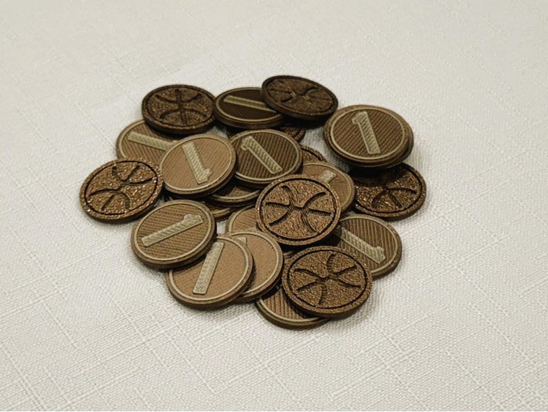 A pile of brown, circular game coins worth one coin. The coins have a raised "1" on the front and a submerged symbol on the back. These premium board game coins replace the standard card board coins.