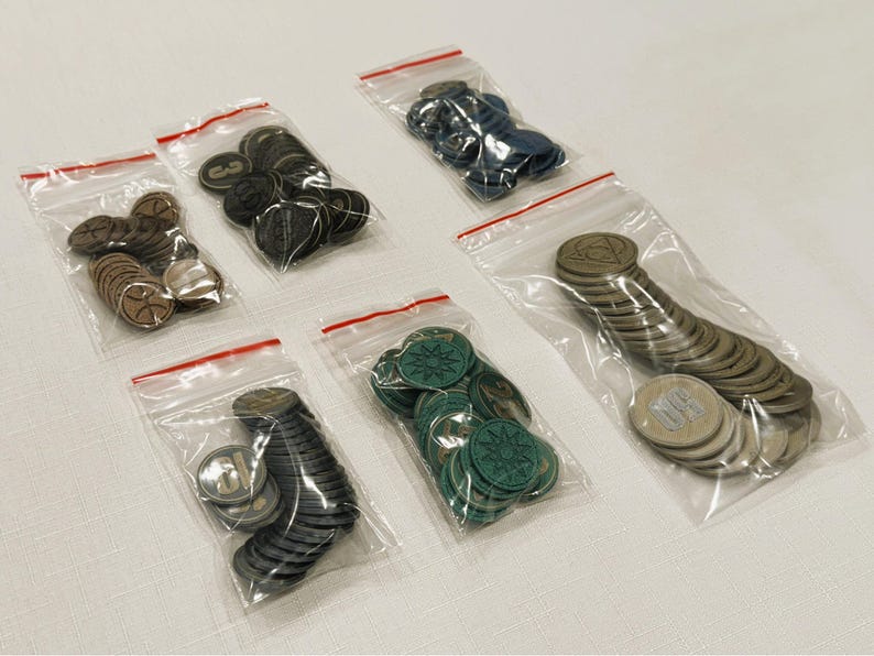 Generic Board Game Coins for sale. Each coin varies in value, size, color and symbol on the coin. Each set of 25 coins is sold in its own zip bag for easy storage and organization.