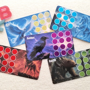 May include: Five rectangular cards featuring elemental themes: Air with a bird, Water with a horse, Aether with a raven, Fire with a wolf, and Earth with a bear. Each card includes a grid of twelve coloured circles and the corresponding element name.