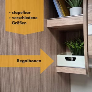 May include: Interior cabinet with a white shelf box containing a green plant. The cabinet is made of wood with a light brown grain. The text on the image says "stackable" and "various sizes".