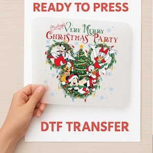 May include: A DTF transfer featuring Mickey Mouse and friends celebrating Christmas. The design includes Mickey, Minnie, Donald, Daisy, Goofy, and Pluto, with a Christmas tree and the text "Mickey's Very Merry Christmas Party". The words "Ready to Press" and "DTF Transfer" are also visible.