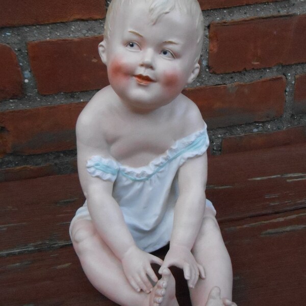 Reserved ..... Antique Gebruder Heubach Bisque Porcelain Piano Baby