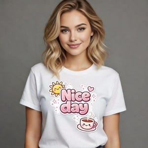 May include: White t-shirt featuring a cartoon design with the words "Nice day". The design includes a smiling sun, hearts, and a cup of coffee with a smiling face. The shirt is short-sleeved.