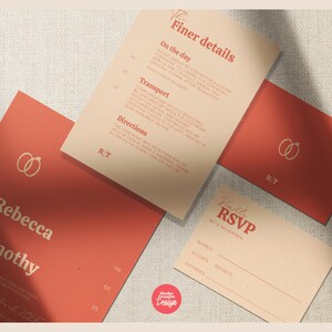 May include: A collection of wedding stationery in coral and cream tones. The set includes an invitation with the names "Rebecca & Timothy", RSVP card, and cards with "Finer details" and wedding ring graphics. The design is minimalist and elegant.