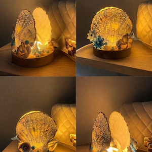 May include: A set of three ceramic mugs with a speckled, matte finish. The mugs are in shades of cream, light gray, and dark gray. Each mug has a simple, minimalist design, perfect for coffee or tea.