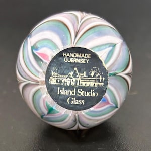 May include: A set of three ceramic nesting bowls in shades of blue, green, and white. The bowls feature a speckled glaze and a simple, modern design. The largest bowl is approximately 7 inches in diameter.