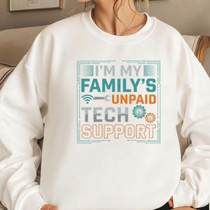 May include: White sweatshirt with the text "I'M MY FAMILY'S UNPAID TECH SUPPORT" in teal, orange, and gray. The design includes a wifi symbol, wrench, and gears. A comfortable, casual top for tech enthusiasts.