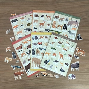 May include: A collection of animal-themed educational posters and stickers. The posters are labeled with the continents: South American, North American, African, European, Asian, and Australian animals. The stickers feature various animals.