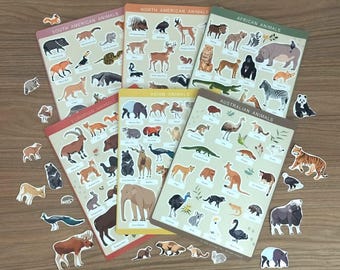 May include: A collection of animal-themed educational posters and stickers. The posters are labeled with the continents: South American, North American, African, European, Asian, and Australian animals. The stickers feature various animals.