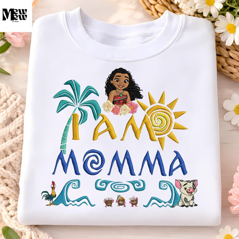A white t-shirt with a colorful design featuring a cartoon character, a sun, palm trees, and various other elements.