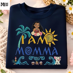 A navy blue t-shirt with a colorful embroidered design featuring a character from the Disney movie "Moana" and the text "I AM MOMA".