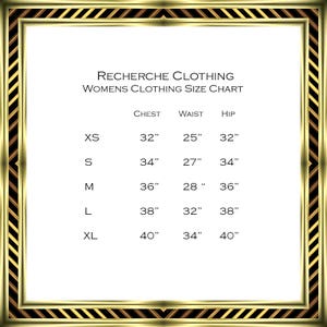 May include: A white clothing size chart with gold trim, featuring the text "RECHERCHE CLOTHING WOMENS CLOTHING SIZE CHART." Measurements are listed in inches for chest, waist, and hip sizes XS to XL, ranging from 32" to 40".