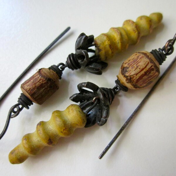 God's Pilgrims - primitive assemblage faded dandelion yellow spiral ceramic horns, pewter petal bead caps, wood bead, & black copper earring