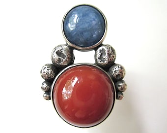 Lingua Franca - primitive organic red chalcedony stone, blue kyanite cabochon, granules, sterling silver metalwork bezel two-stone ring