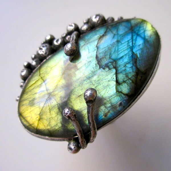 Schiller -primitive organic flash blue, teal, green, gold labradorite cabochon, prong, crater, oxidized sterling silver metalwork bezel ring