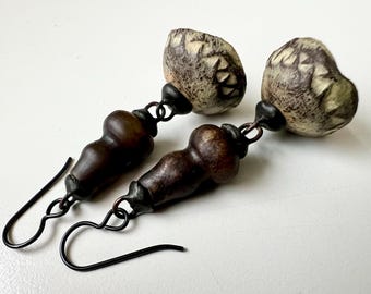 Storm Leathered - primitive organic tribal handmade ceramic silent bell, carved serpentine trade bead, black metal soldered dangle earrings