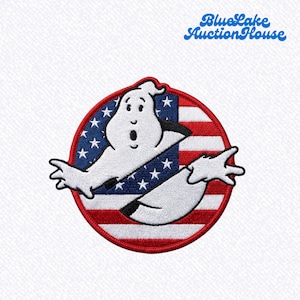 May include: A circular embroidered patch featuring a white cartoon ghost character centered over a red, white, and blue American flag design with stars and stripes. The patch has a thick red border and is set against a white textured background.