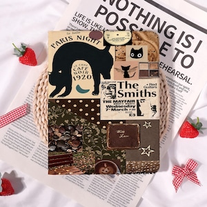 May include: A rectangular notebook cover featuring a collage of vintage-style graphics, including a black cat silhouette with the text Paris Night Le Chat Cafe Noir 1920, a The Smiths concert poster, a coffee cup, brown buttons, and gold stars.