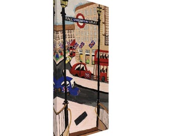 May include: A canvas print depicting a London street scene. The artwork features red double-decker buses, cars with Union Jack flags, and buildings with British flags. The words "Public Underground Subway" are visible.