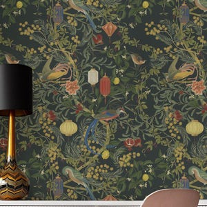 May include: Dark green wallpaper featuring a repeating pattern of birds, lanterns, and botanical elements. The design includes colorful birds with long tails, red and yellow lanterns, and various fruits and flowers. The overall aesthetic is a vintage, nature-inspired theme.