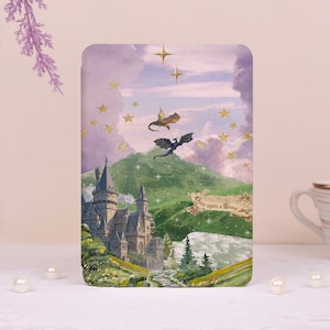 May include: A rectangular tablet case featuring a fantasy illustration of a stone castle, green hills, and two dragons flying in a purple sky filled with gold stars. A decorative scroll banner with the text Once upon a Time is displayed.