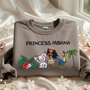 A gray sweatshirt with a design featuring characters from the Disney movie " princess Moana".