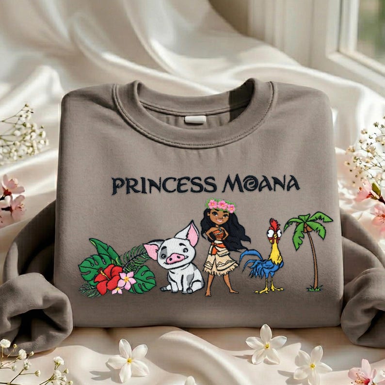 A gray sweatshirt with a design featuring characters from the Disney movie " princess Moana".