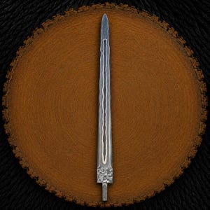 May include: A double-edged dagger blade featuring a dark, layered Damascus steel pattern with a central copper inlay running vertically along the length. The blade has a pointed tip and a textured, rectangular tang at the base for handle attachment.
