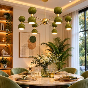May include: A multi-arm chandelier featuring a central gold-toned metal rod with ten spherical olive green shades. Each arm extends outward, ending in a pair of stacked globes, with the bottom globes emitting a warm, downward-facing light.