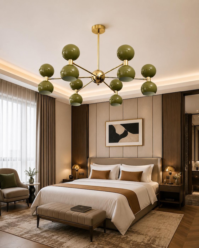 May include: A ceiling chandelier featuring a central gold-toned metal rod with multiple branching arms, each ending in a pair of stacked olive green spherical globes. The fixture is suspended from the ceiling, showcasing a symmetrical design.