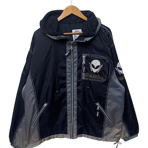 May include: Black and gray hooded jacket with a zipper closure. The jacket features a design with an alien head and the text "aliennation". The jacket has two front pockets and a drawstring at the bottom.