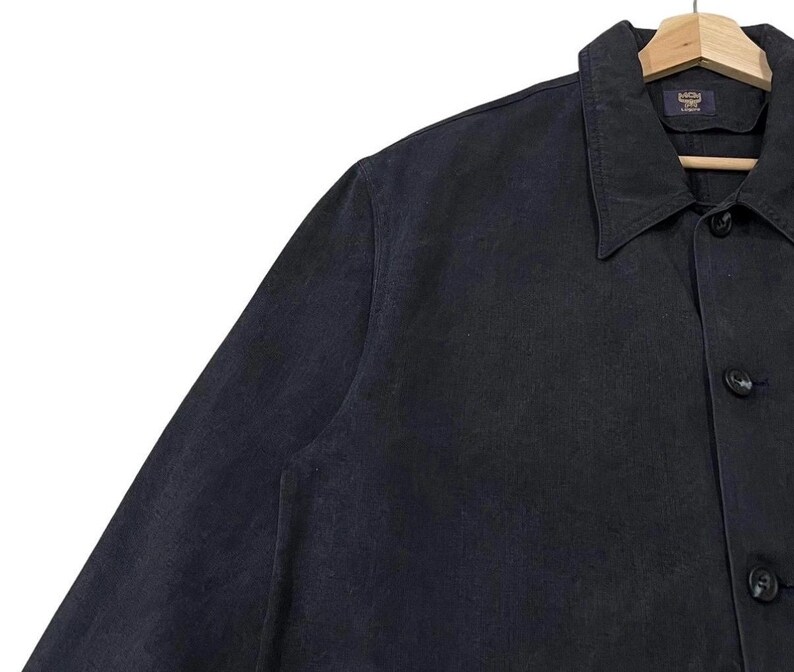 May include: A set of three ceramic nesting bowls in graduating sizes. The bowls have a speckled, matte finish in cream, light brown, and dark brown. The largest bowl is about 20 cm in diameter.