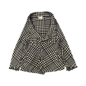 May include: A black and white plaid jacket with a shawl collar and frayed edges. The jacket features a mix of large and small plaid patterns. The garment is made of a textured fabric.