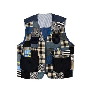 May include: A sleeveless vest featuring a patchwork design of various fabrics including black and white buffalo plaid, floral prints, denim, and striped patterns. The garment includes two large black patch pockets and two smaller chest pockets.