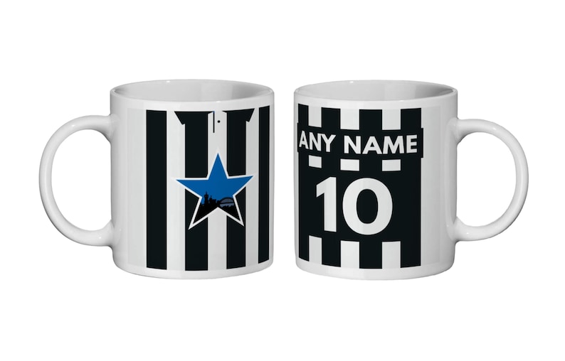 May include: Two white ceramic mugs with black and white striped designs. One mug features a blue star with a city silhouette, the other has the text "ANY NAME" above the number "10".