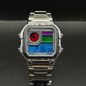 May include: A silver Casio digital watch with a stainless steel band. The watch face displays the time, date, and other functions. The watch has the text "WORLD TIME", "CASIO", and "10 YEAR BATTERY".