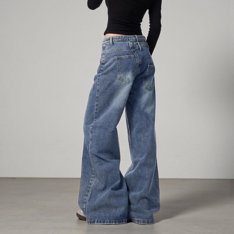 Women's Baggy Button Jeans | Irregular Stacked Pants | Streetwear Y2k Fashion

Wide-leg stacked denim pants with an irregular button fly, styled with a fitted long-sleeve top in a studio setting.