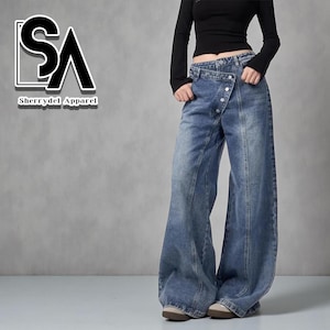 Women's Baggy Button Jeans | Irregular Stacked Pants | Streetwear Y2k Fashion

Wide-leg stacked denim pants with an irregular button fly, styled with a fitted long-sleeve top in a studio setting.