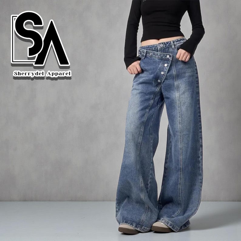 Women's Baggy Button Jeans | Irregular Stacked Pants | Streetwear Y2k Fashion

Wide-leg stacked denim pants with an irregular button fly, styled with a fitted long-sleeve top in a studio setting.