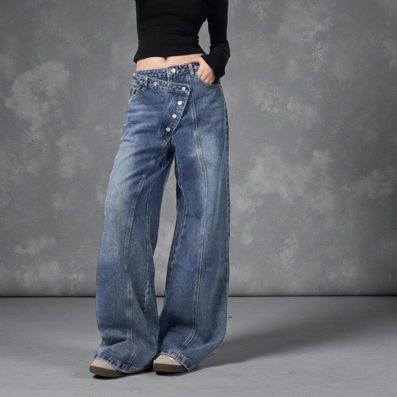 Women's Baggy Button Jeans | Irregular Stacked Pants | Streetwear Y2k Fashion

Wide-leg stacked denim pants with an irregular button fly, styled with a fitted long-sleeve top in a studio setting.