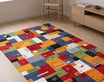 May include: A rectangular area rug featuring a patchwork design of multicolored blocks in red, blue, yellow, green, black, and white. The rug displays various small geometric patterns, including stripes, dots, and stylized animal figures throughout.