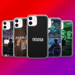May include: A collection of iPhone cases with various designs related to trading and finance. The cases feature images of stock charts, the word "TRADER", and motivational quotes. The cases are in a row against a gradient red to purple background.