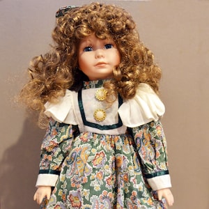 Porcelain Doll With Brown Hair and Paisley Print Dress