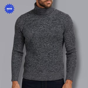 May include: A gray turtleneck sweater with a textured knit pattern. The sweater has long sleeves and a ribbed hem and cuffs. A blue starburst graphic with the word "NEW" is in the upper left corner.