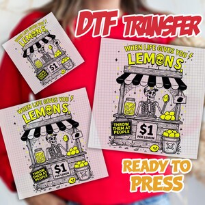 May include: A DTF transfer sheet featuring a skeleton running a lemonade stand with the text When Life Gives You Lemons, Throw Them At People, $1 Per Lemon. The graphic includes a jar of lemon slices, a bucket of lemons, and a skull icon.